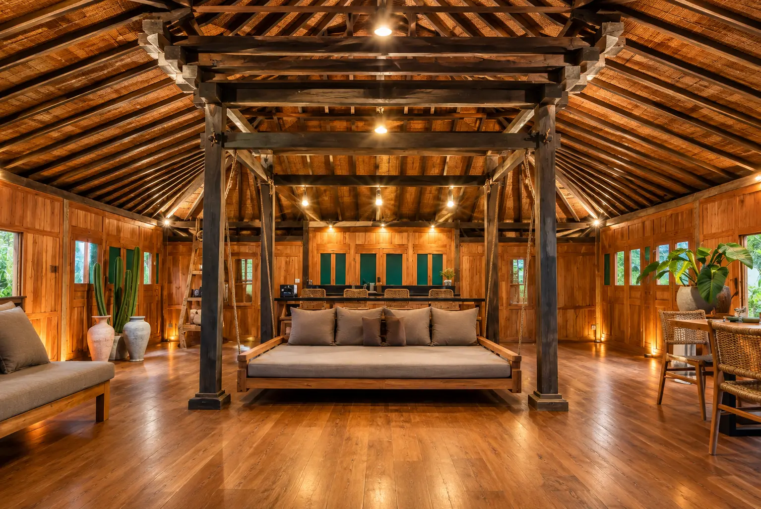 Warm wooden villa interior with a traditional Balinese swing bed and handcrafted timber details